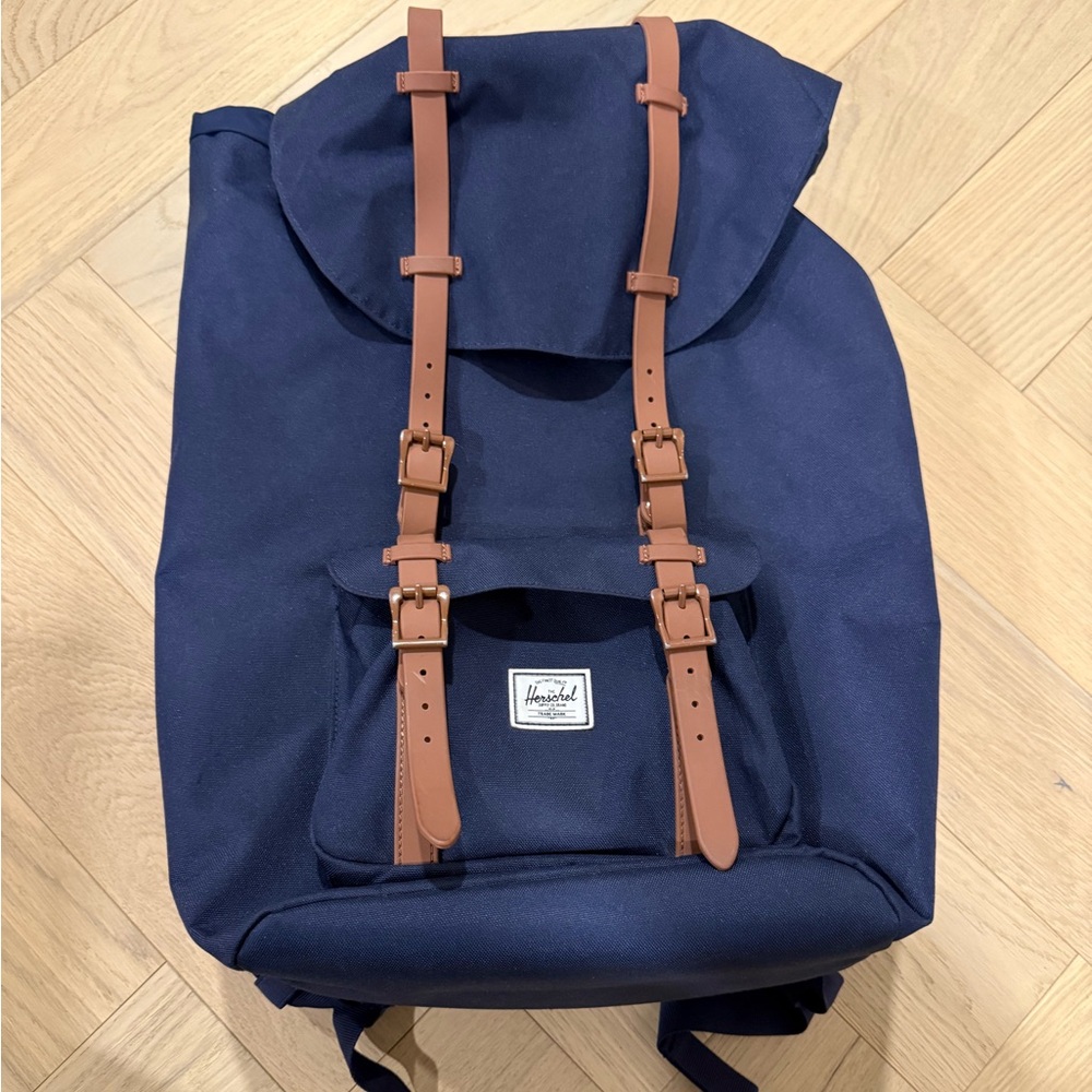 Slightly used blue Hershel Supply Co backpack for sale. It great condition.